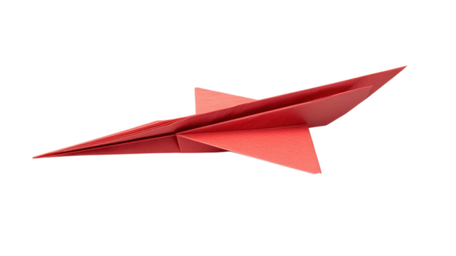 A red origami airplane sits on a white surface, highlighting minimalist paper folding art