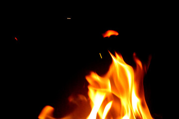 Close up burning flames on black background for graphic design or wallpaper.