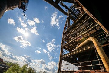 Fototapeta premium Abandoned Heavy Industrial Ruins with Large Blast Furnace in Steelworks