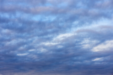 Fototapeta premium Blue sky with clouds in the evening over the city, isolated