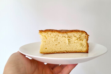 Slice of Light Fluffy Sponge Cake on White Plate for Dessert Photography