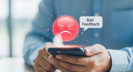 Customer expresses dissatisfaction with a negative review and unhappy emoji displayed on a smartphone screen
