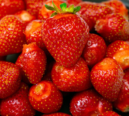 Juicy seasonal strawberries close up macro texture