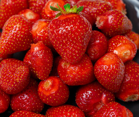 Juicy seasonal strawberries close up macro texture