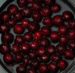 Juicy seasonal black cherries close-up