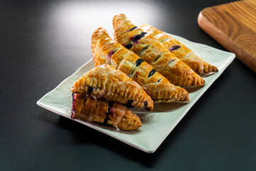 Blueberry and Apricot Jam Triangles Pie. Puff Pastry. Dessert