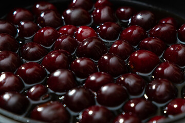 Juicy seasonal black cherries close-up