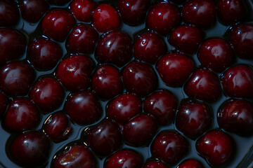Juicy seasonal black cherries close-up