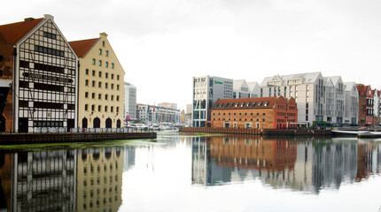 Gdańsk waterfront with historic architecture and reflections, Poland © Piotrek