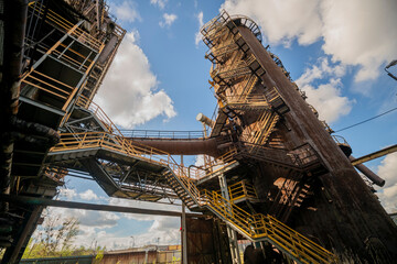 Fototapeta premium Abandoned Heavy Industrial Ruins with Large Blast Furnace in Steelworks