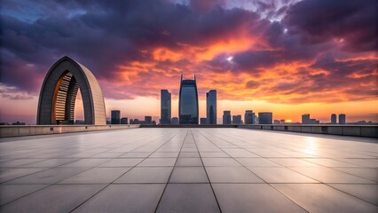 Dramatic sunset over modern cityscape with gothic archway