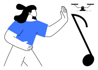 Confident woman in blue shirt raises hand toward hovering drone, emphasizing control and technological awareness. Ideal for themes thumbs up security, innovation, balance, caution, advancement