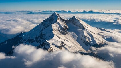 Fototapeta premium Beautiful mountains covered in winter snow, clear light blue sky with some clouds. Picturesque nature glacier landscape photograph. A scenic panoramic view of a majestic snowy mountain peak. 