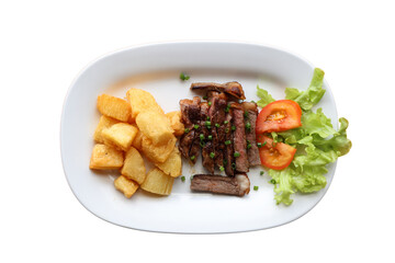 Grilled steak with fried cassava and fresh salad
