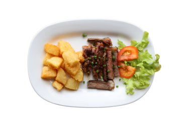 Grilled steak with fried cassava and fresh salad
