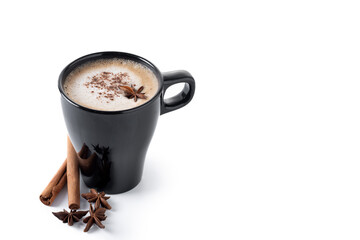 Chai Latte in Black Mug with cinnamon and star anise isolated on white background. Copy space