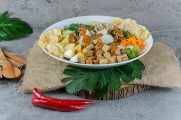 Traditional Indonesian Gado-Gado Salad with Peanut Sauce, Vegetables, and Boiled Egg