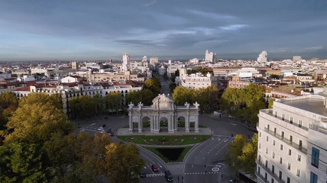 Aerial view of the majestic Puerta de Alcal&aacute;, surrounded by trees with autumn colors, in Madrid, Comunidad de Madrid, Spain.