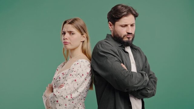 Young Offended Couple After Quarreling, Standing Back. Selfishness, Resentment
