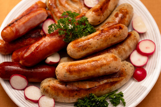 Top view of traditional German sausages and radishes