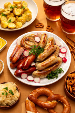 Top view of traditional German feast with beer and sausages