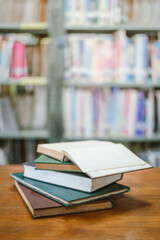 Books in the library and a laptop represent the concept of basic education.
