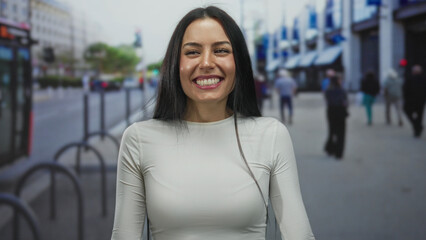 Woman smiling on city street with joyful expression showcasing vibrant urban scene and dynamic energy of outdoor lifestyle