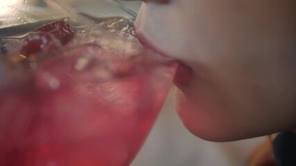 young woman drinking water cocktail - Powered by Adobe