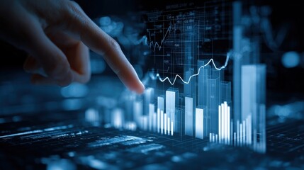 Hand pointing at financial data chart blue background.