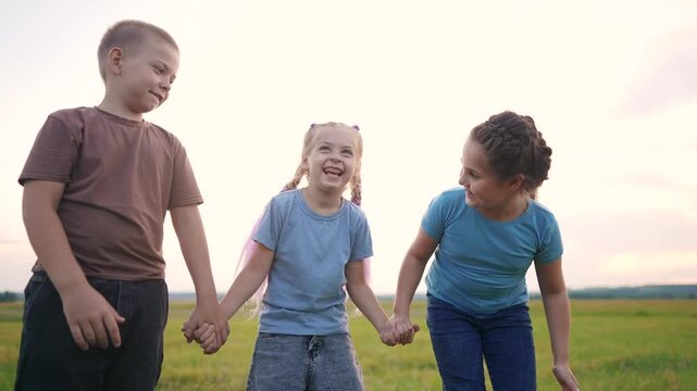 the boy pulls the pigtails the girl indulges. happy family kid dream concept. children holding hands boy touching his sister's braid hair lifestyle