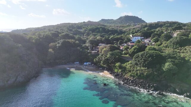 Aerial view of Praia do Cachorro beach in Fernando de Noronha, crystal-clear waters and stunning coastline highlight Brazil&rsquo;s iconic eco-tourism destination