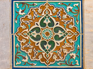 Islamic Geometric Tile Pattern with Floral Motifs in Blue and Gold
