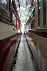 Crich Tramway Museum, England – August 13 2025: Close Up View Between Vintage Edwardian Double Deck Trams in the Depot