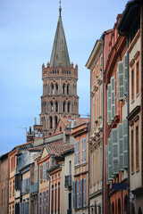 The most beautiful street of Toulouse - rue du Taur - with the view on the tower of Saint Sernin cathedral