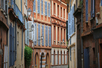 Typical narrow street of Toulouse city in the south of France