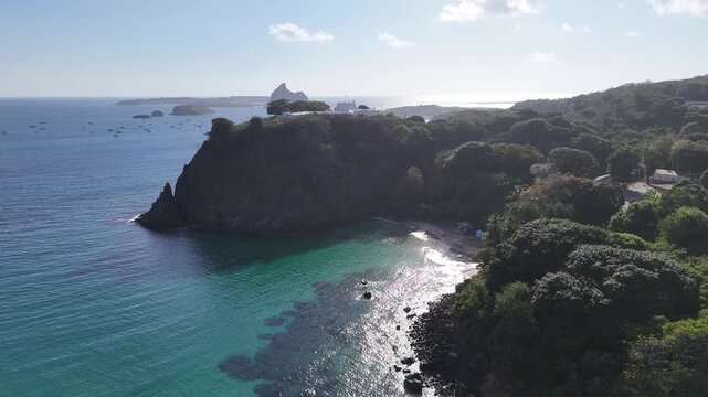 Drone footage of Praia do Cachorro, Fernando de Noronha, showing turquoise waters, golden sand, and natural beauty of Brazil&rsquo;s Atlantic paradise island