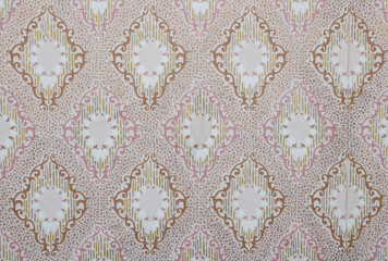 Old wallpaper on the wall. Old wallpaper for texture or background.