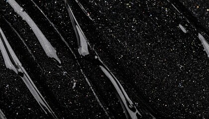 Glossy Black Gel with Sparkling Glitter Streaks on Dark Background