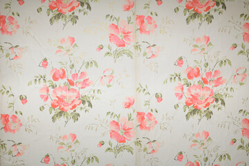 Old wallpaper on the wall. Old wallpaper for texture or background.