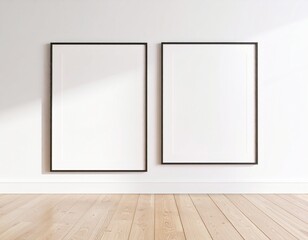 Minimalist room with two blank black frames on white wall, light wooden floor, and sunlight.