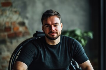 Fototapeta premium Confident portrait of a disabled entrepreneur in a creative workspace setting