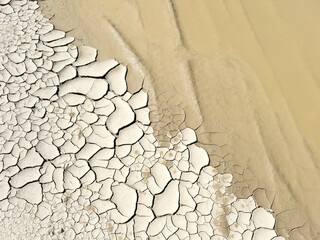 Parched Cracked Earth Surface in a Dry Lakeshore Landscape