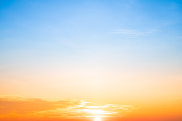 Fototapeta premium Beautiful , luxury soft gradient orange gold clouds and sunlight on the blue sky perfect for the background, take in evening,Twilight, Large size, high definition landscape photo