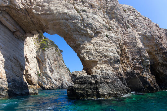 Natural Stone Arch Over Seawater Along the Coastal Cliffs. Zakynthos - Greece