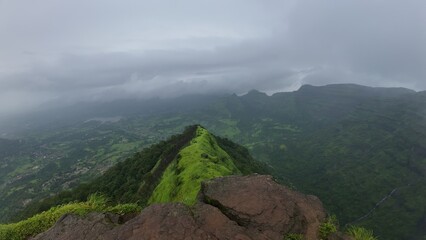 Lush Green Hills Covered in Mist During Monsoon in Maharashtra