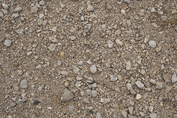 A rocky, dry ground with a lot of rocks scattered around