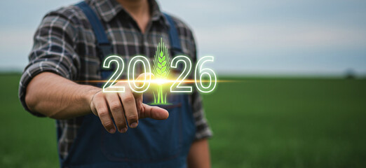 Farmer touching a glowing 2026 with a wheat ear icon on a lush green field background