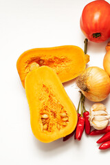 Fresh organic butternut squash with tomatoes, onion, garlic and chili peppers