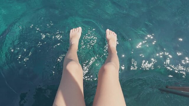 small girl on the swim deck of a yacht in greece