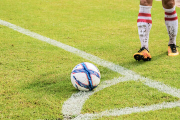 Young soccer player in a corner kick.